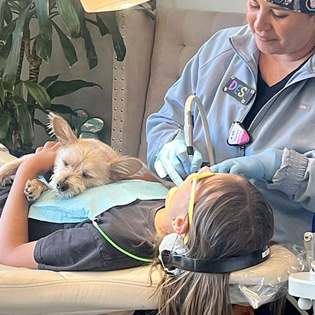 patient in chair with buddy