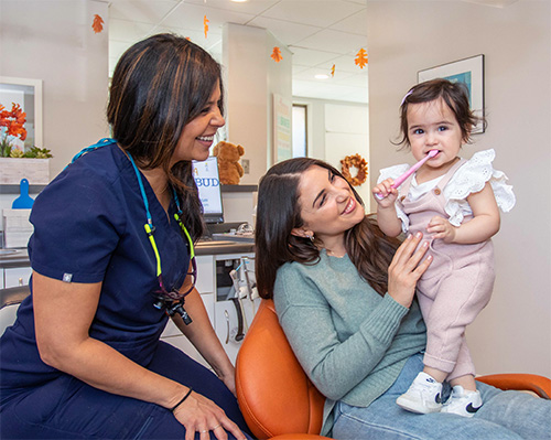 Dentist with a parent and child