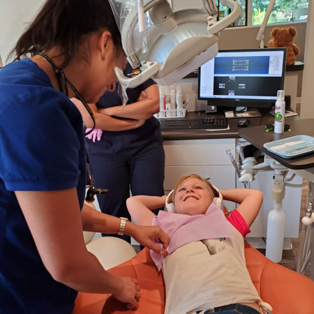 smiling child on dental chair