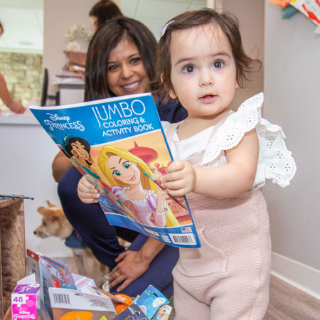 child holding a book