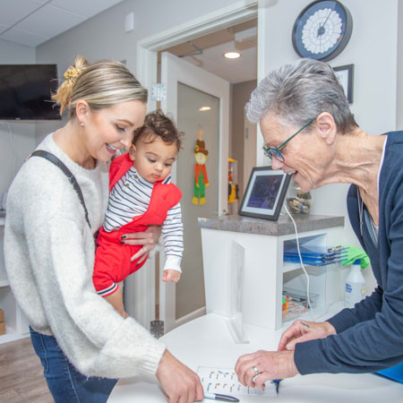 mother and child at front desk