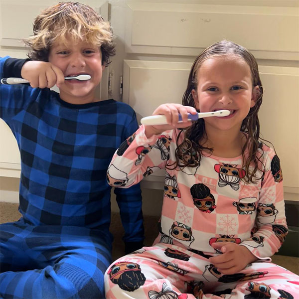 boy and girl with toothbrushes